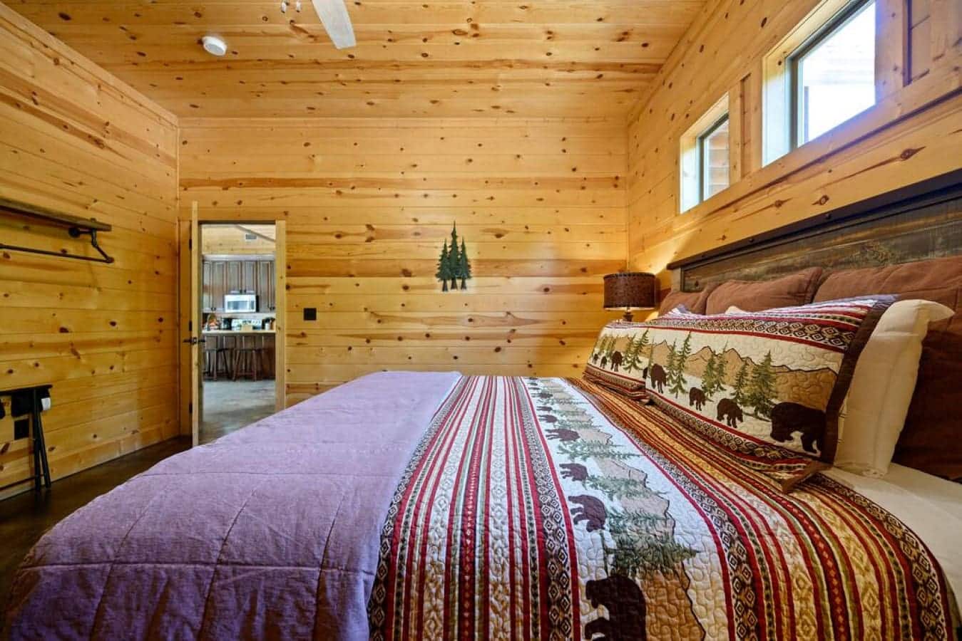 Rest easy in this cabin bedroom, where the allure of simplicity and the whispering winds outside create a haven of tranquility.