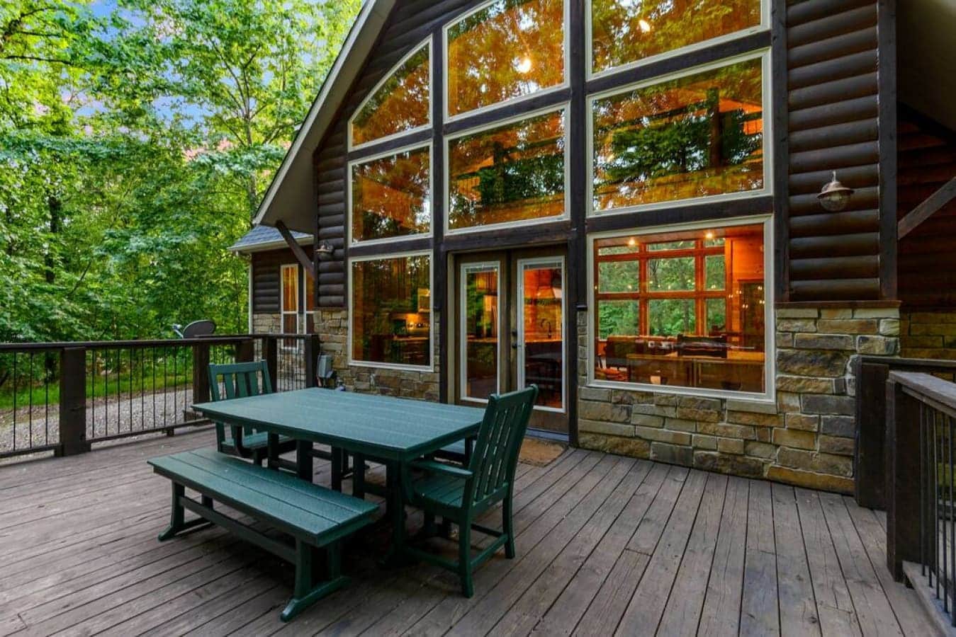 Escape to the cabin life where the deck beckons with a bubbling hot tub, a sizzling grill, and a table set for leisurely meals surrounded by the great outdoors.