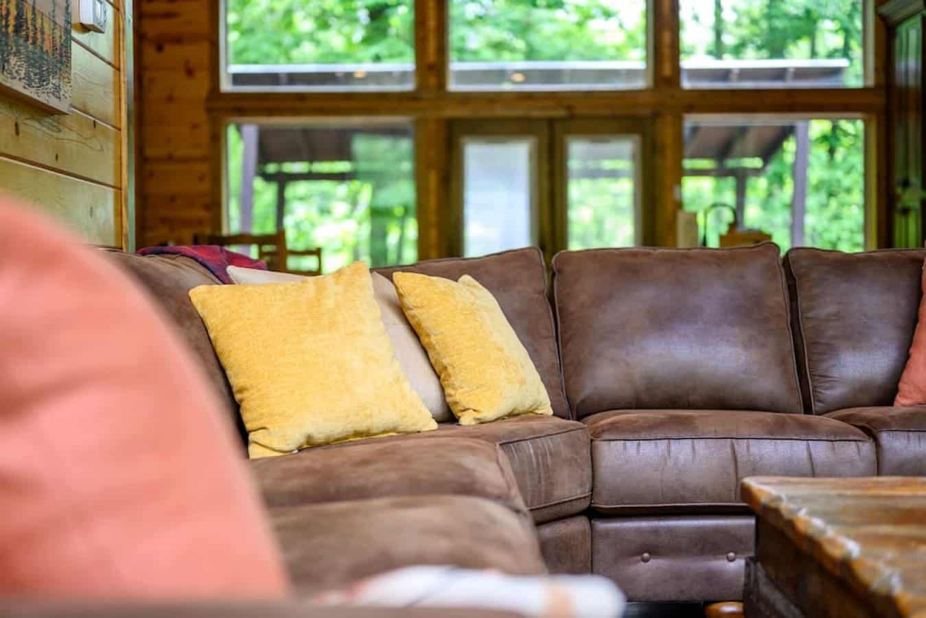 Sink into luxury: Our cabin's leather sofa offers unparalleled comfort, inviting you to unwind and relax in style after a day of adventure.