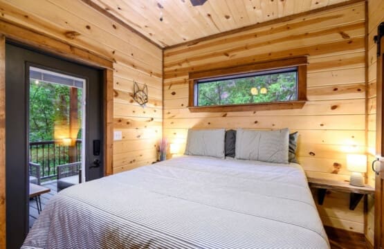 Embrace the warmth of the cabin and the embrace of slumber in the comfort of the bedroom.