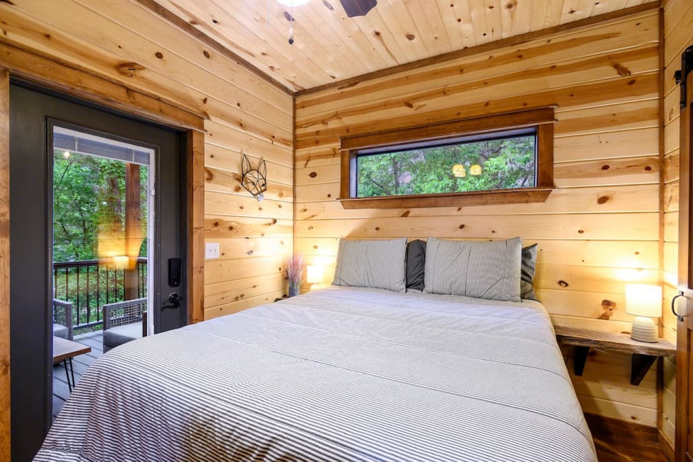 Embrace the warmth of the cabin and the embrace of slumber in the comfort of the bedroom.