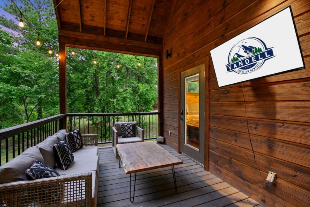 Where mornings are greeted with birdsong and coffee: Our cabin porch retreat.
