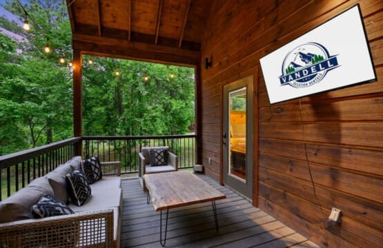 Where mornings are greeted with birdsong and coffee: Our cabin porch retreat.