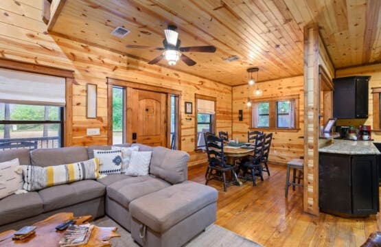 From cozy dinners to fireside chats: Our cabin's inviting living and dining space.