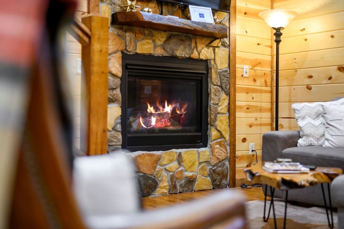 Escape the cold, embrace the warmth: Our cabin's inviting hearth.