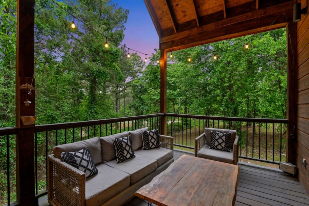 Breathe in the mountain air, exhale your worries: Our outdoor cabin porch.