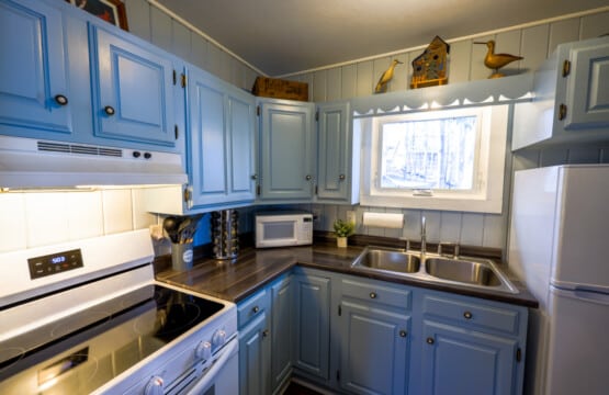 Powder-blue cabinets and charming details make even cooking feel like a getaway.