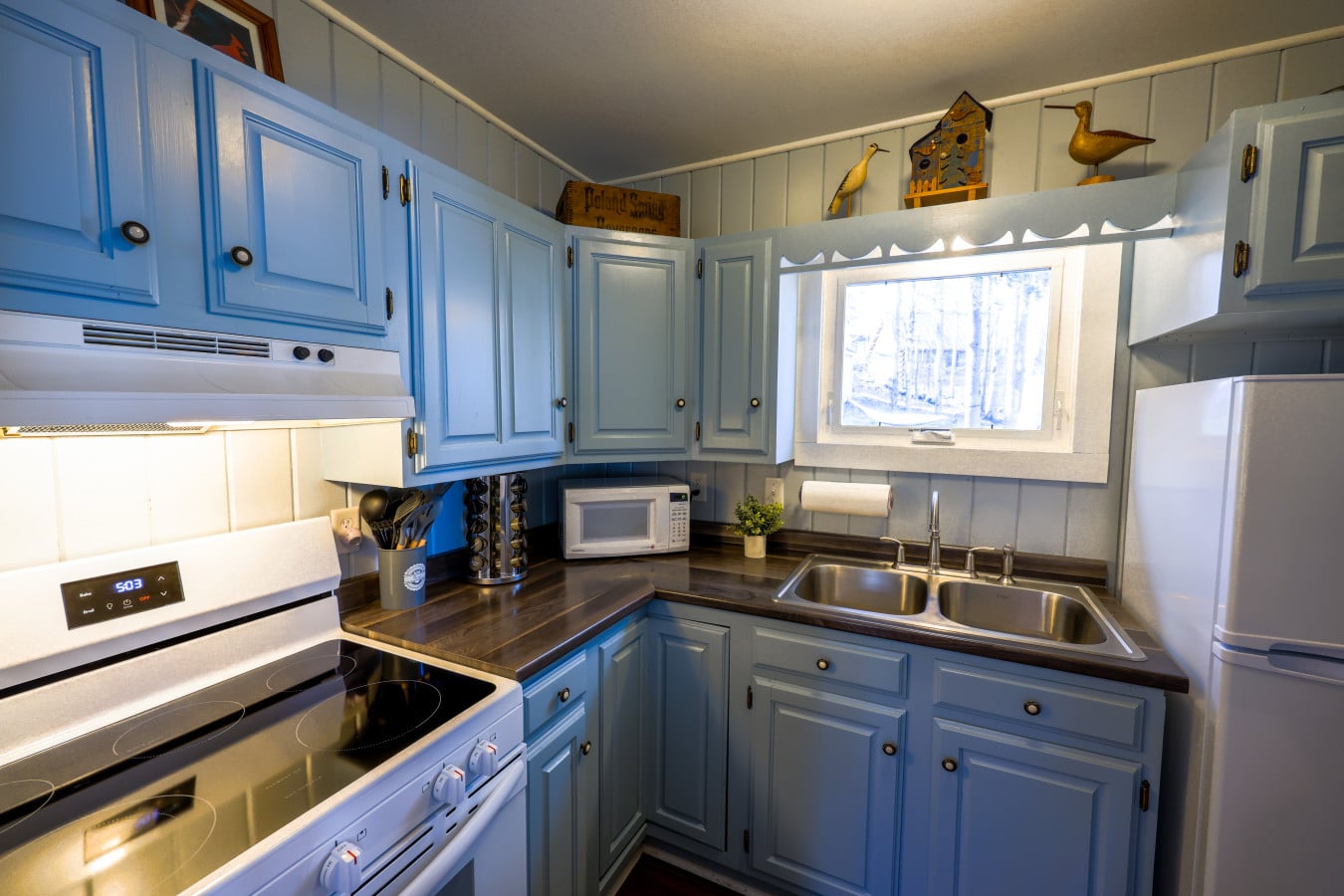 Powder-blue cabinets and charming details make even cooking feel like a getaway.