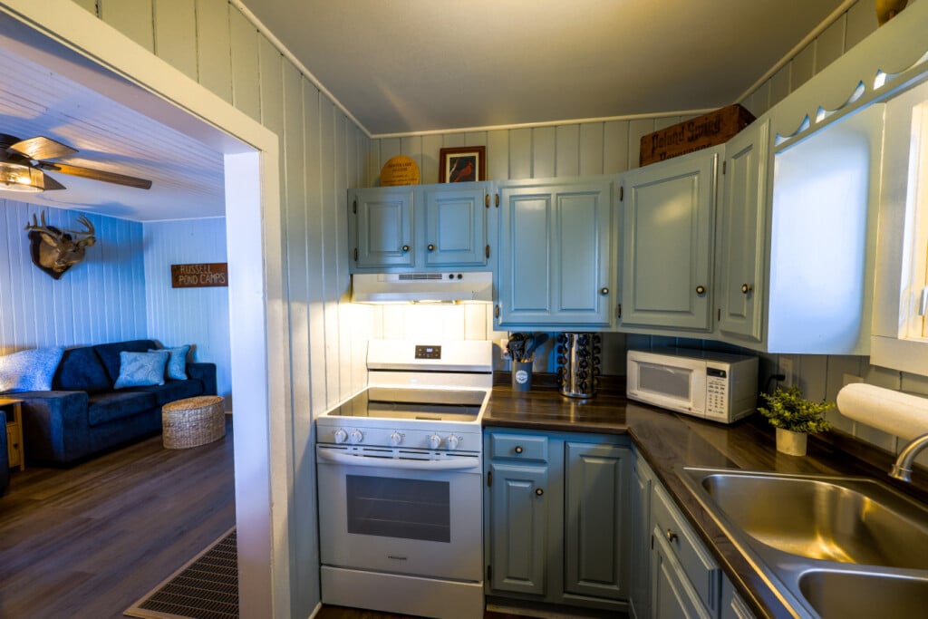 The kitchen flows straight into the living room so no one misses a moment of fun.
