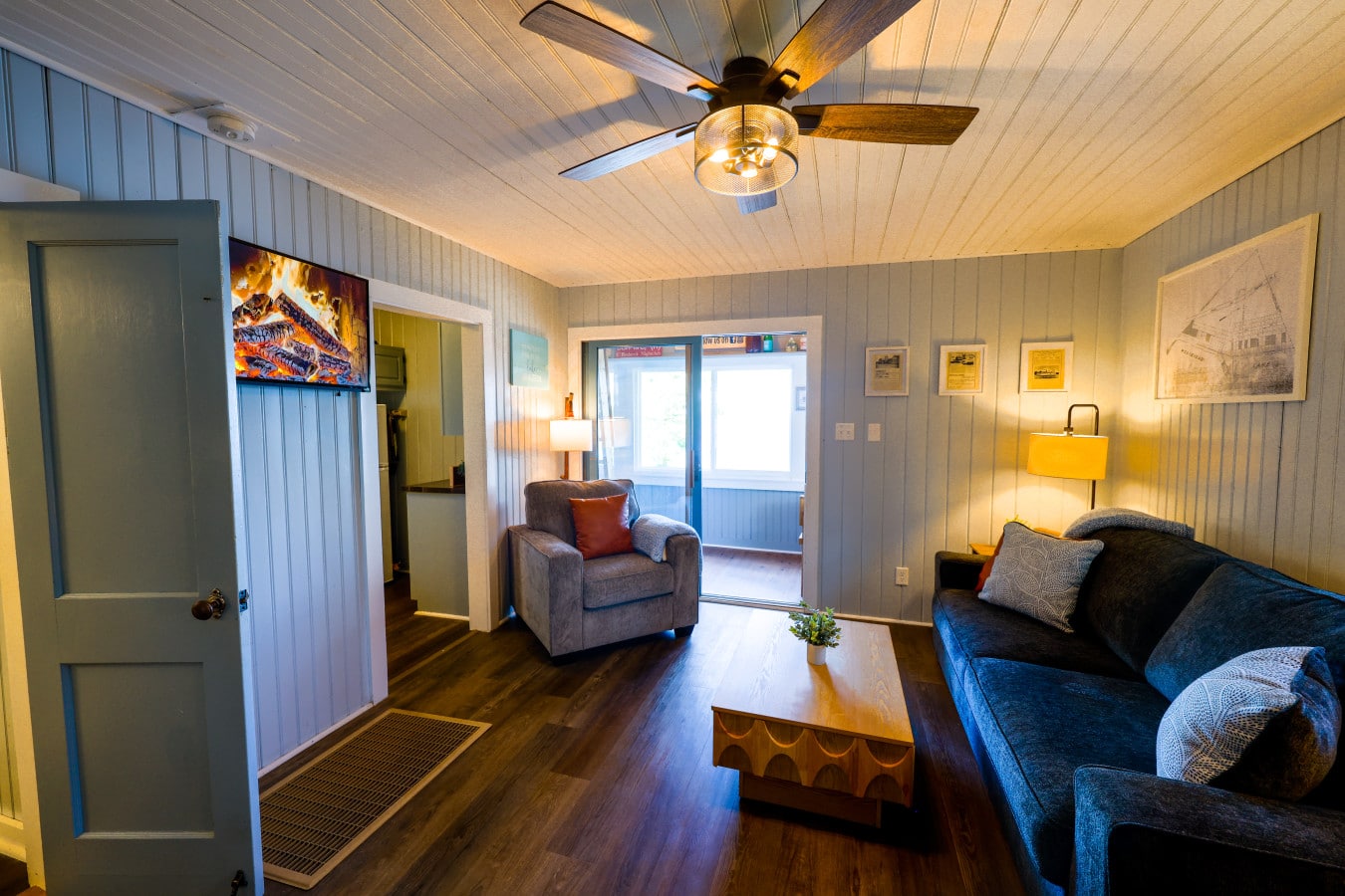 Curl up with a movie by the virtual fire while lamplight warms the whole room.