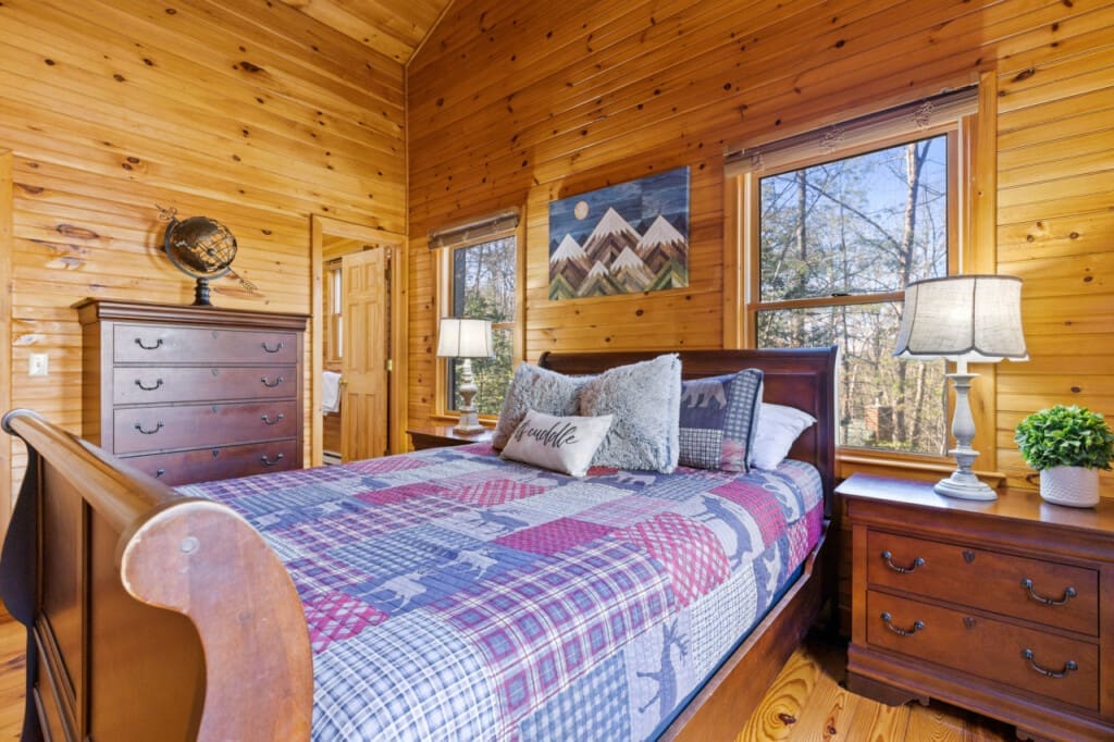 Rustic serenity meets cozy comfort in our cabin bedroom retreat.