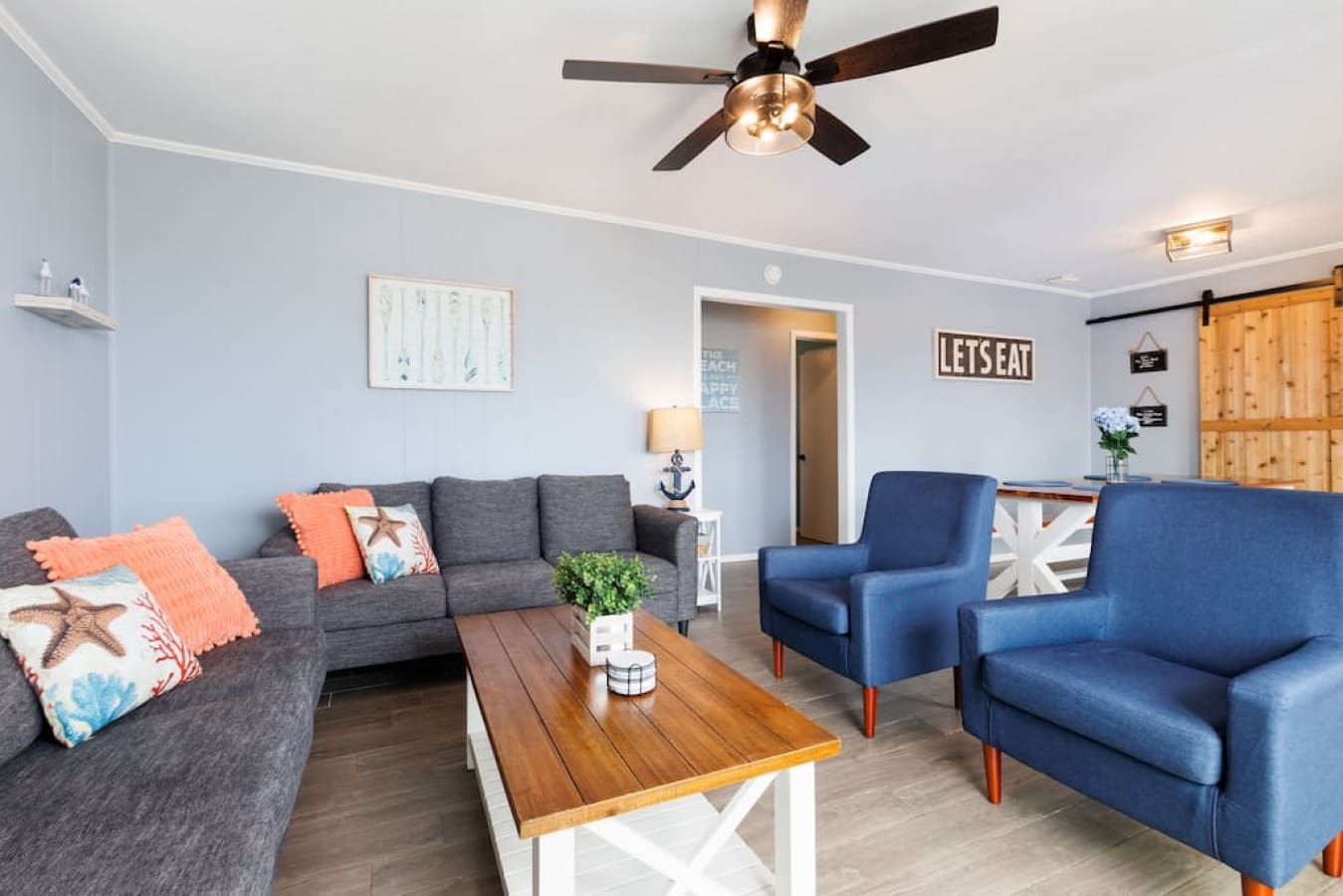 Kick back in this breezy living room where coastal vibes and sink-into-the-cushions comfort make it basically impossible to leave.
