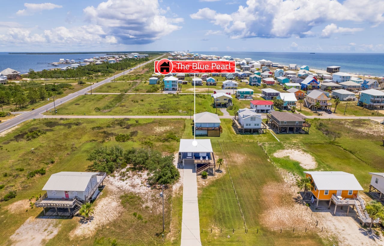 These candy-colored beach cottages are basically what happens when someone asks "why pick just one color?" and you say "I won't."