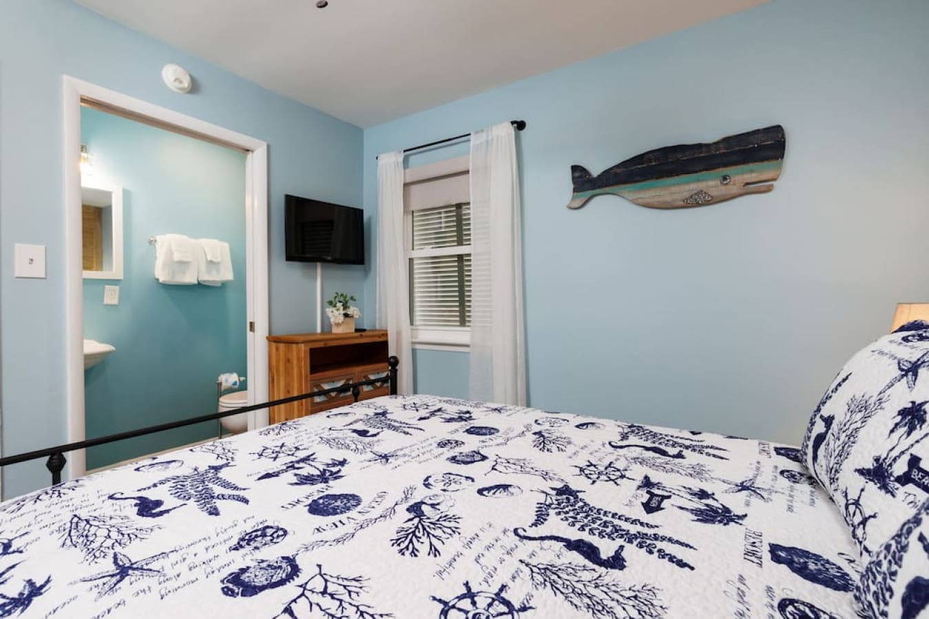 Wake up to the sound of waves with this cozy coastal retreat decked out in all the nautical vibes you could want.