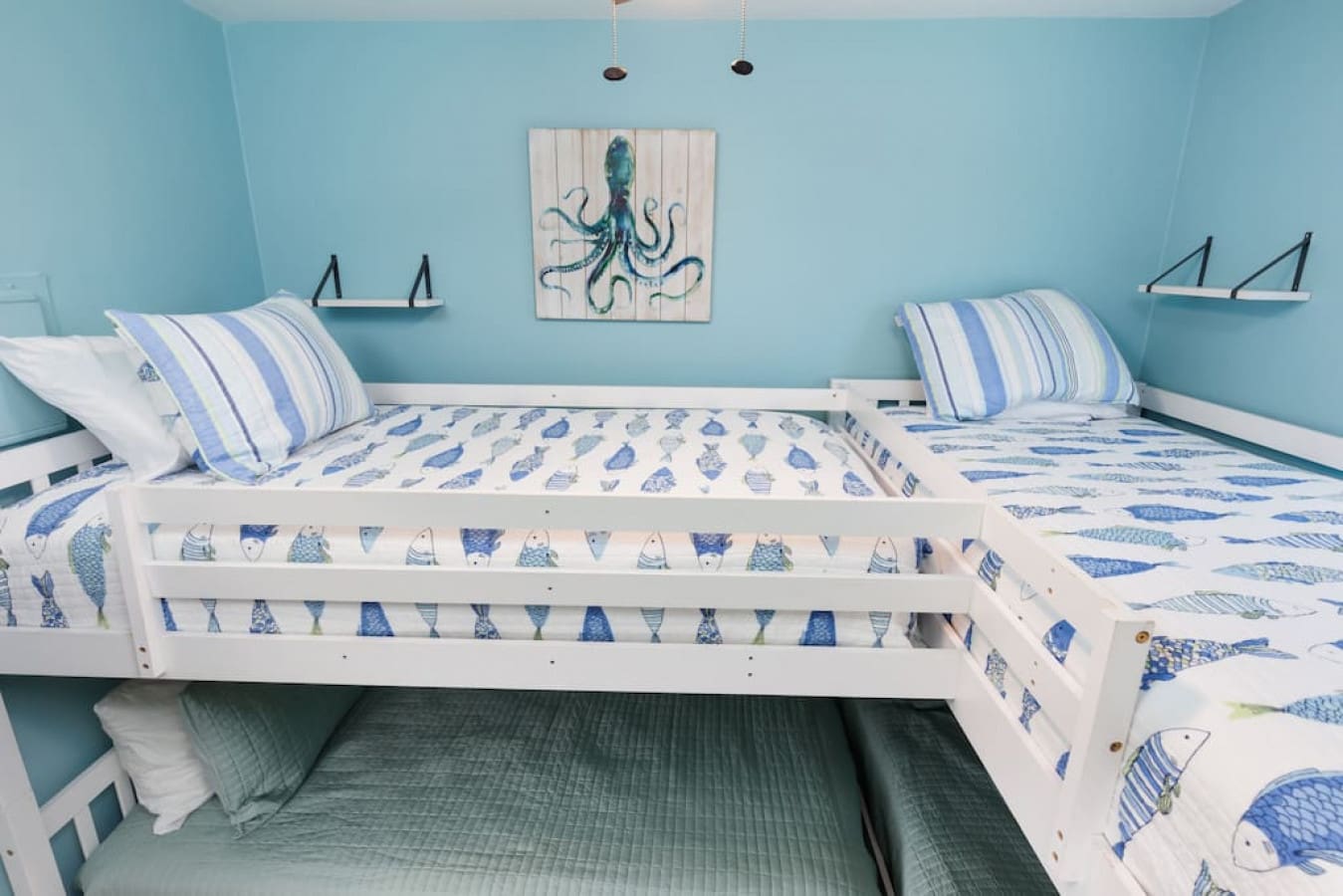 Two cozy beds dressed up in all their nautical glory—perfect for the crew who wants to sleep like they're actually out on the water.