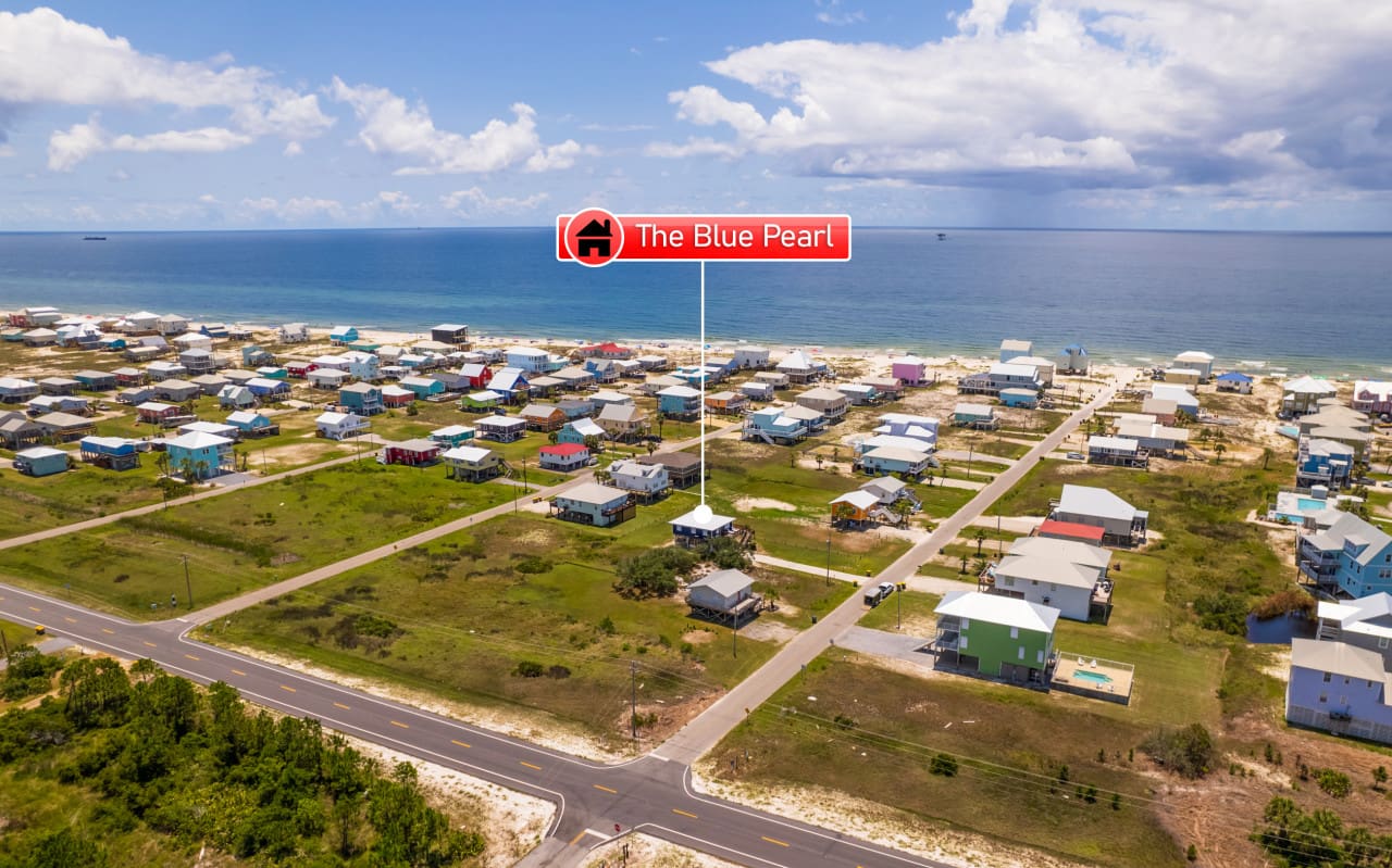 These candy-colored beachfront houses are basically a real-life postcard where you actually get to stay.
