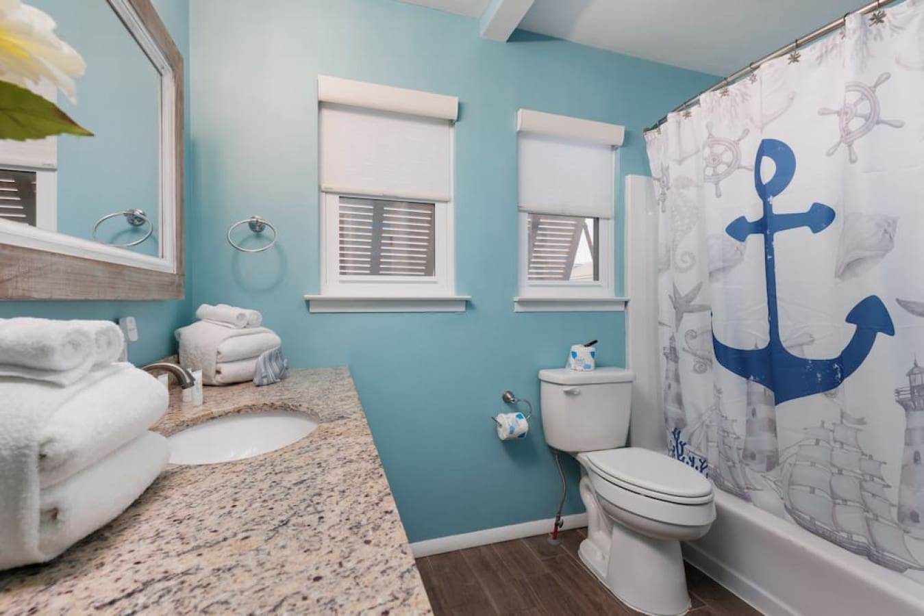 Your morning routine just got way more fun with these turquoise walls giving major beach-house vibes.