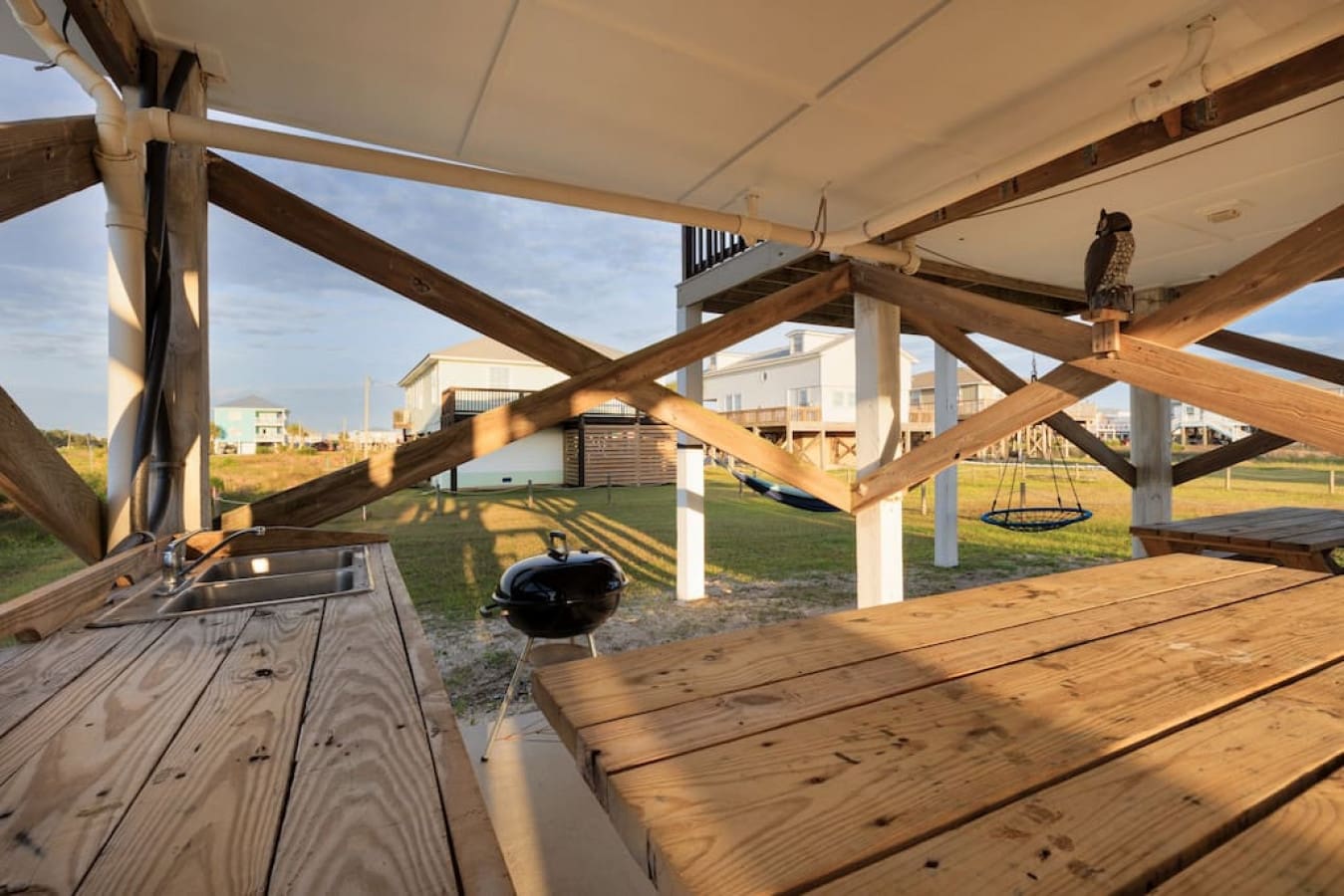 Swing into the evening on the covered deck where the grill's always fired up and the breeze does all the entertaining.