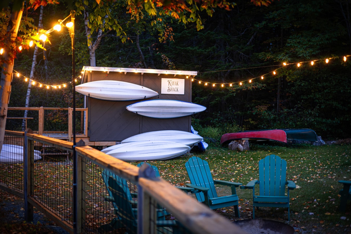 Kayaks waiting, water sparkling.
