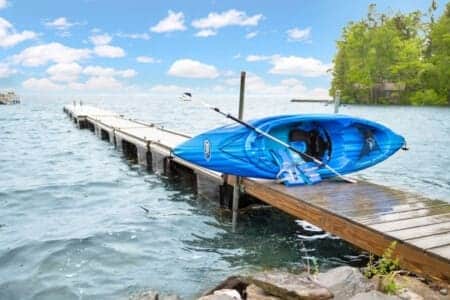 Kayak poised on the jetty, waiting for adventure.