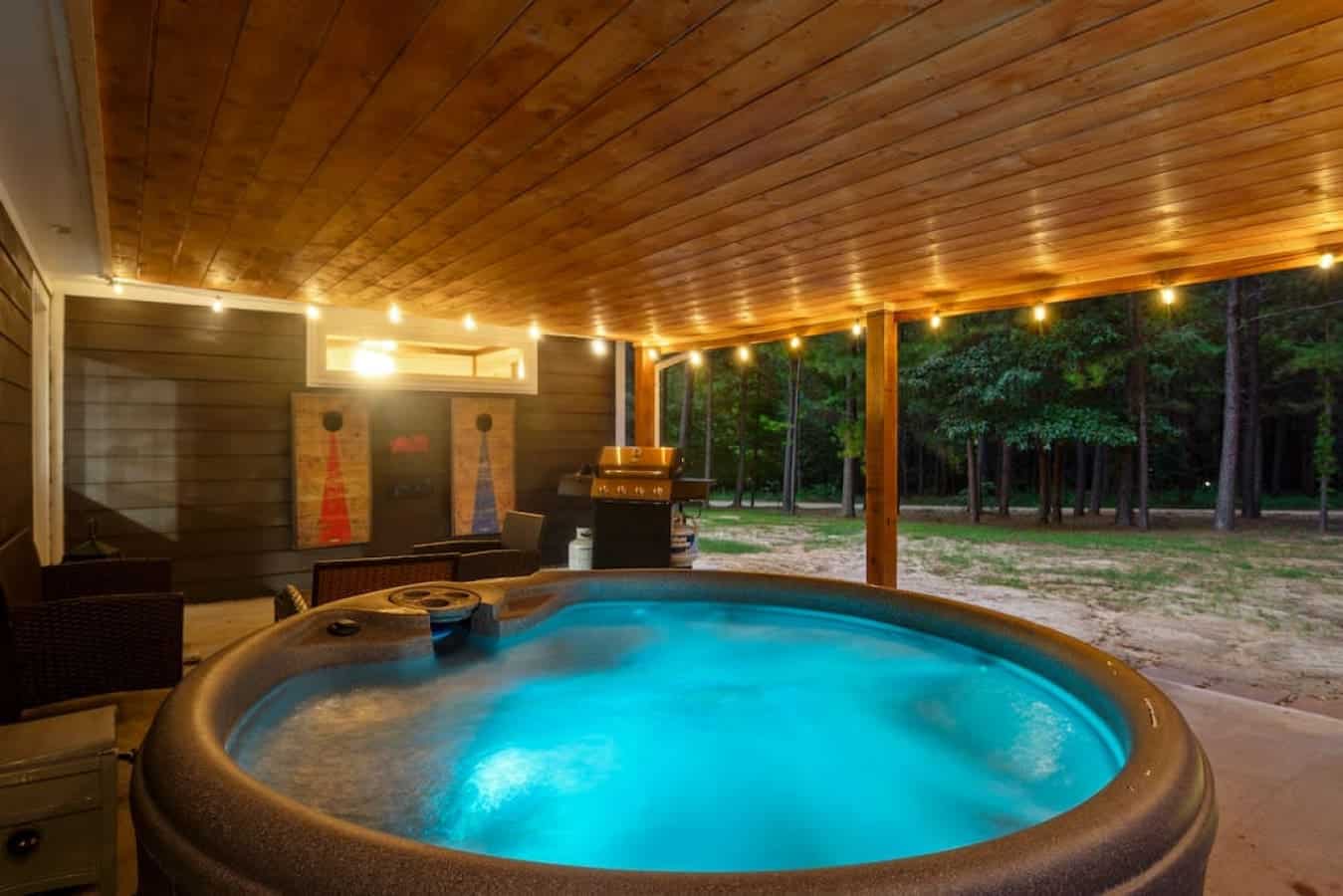 Unwind in style with Makin Time's inviting hot tub on the patio, offering the perfect retreat for relaxation and rejuvenation.