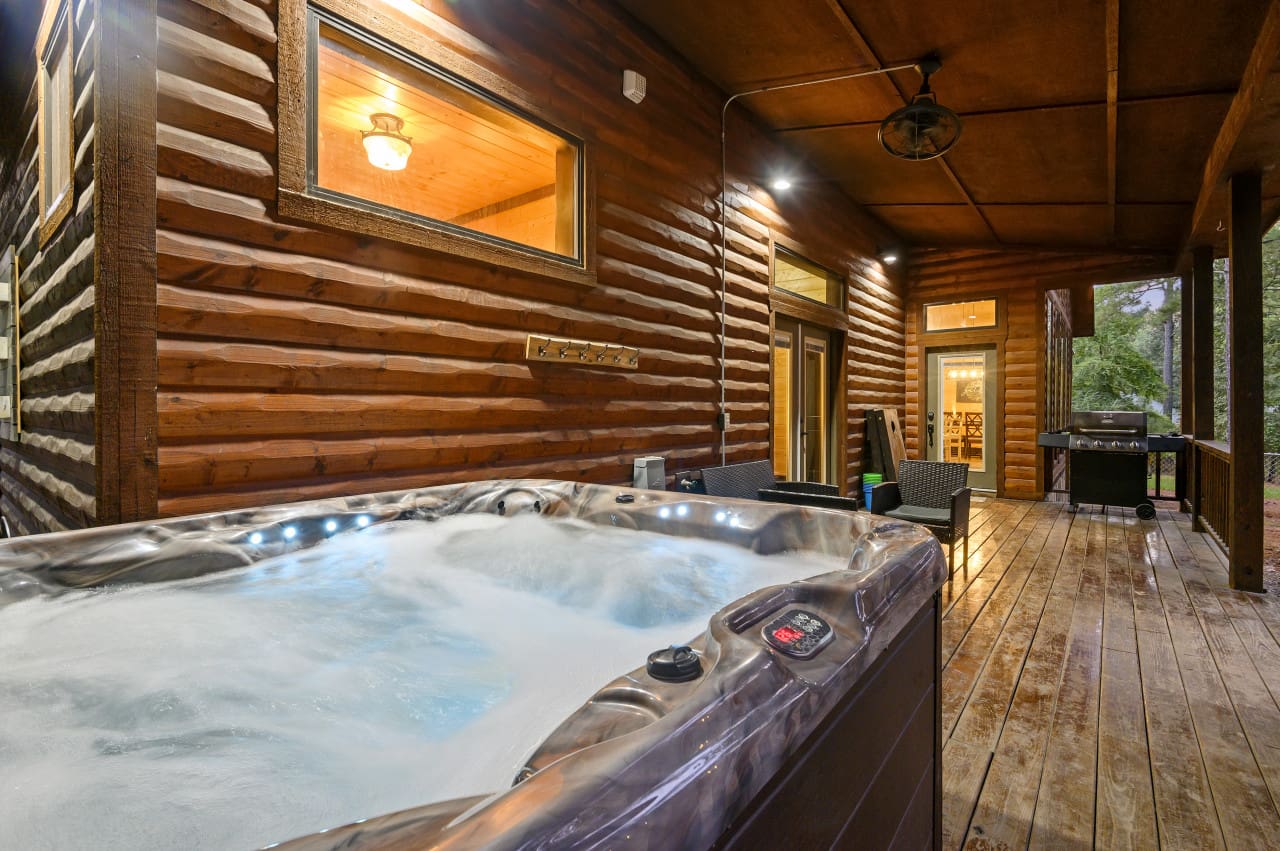 Relax and rejuvenate in style with Tucker'd Out's inviting hot tub situated on the deck.