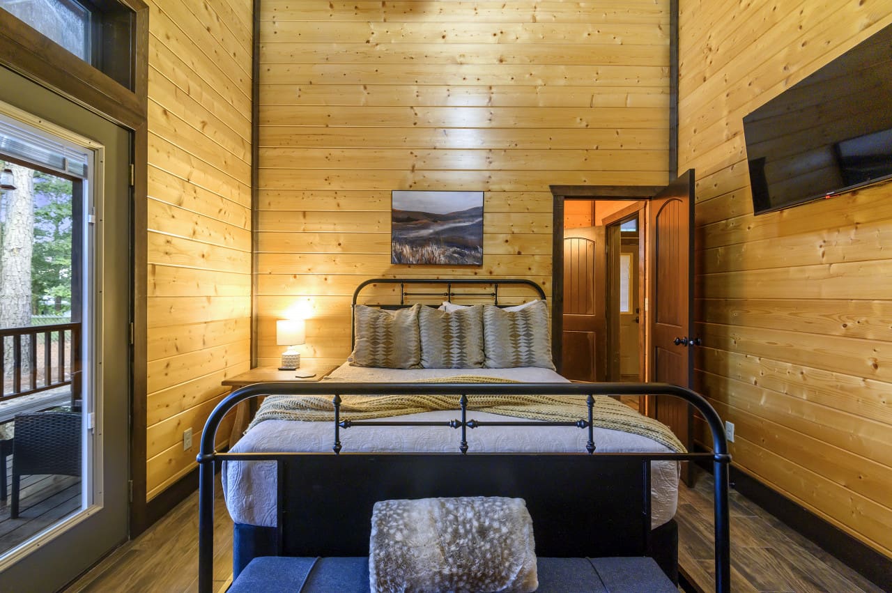 Cozy nights with our sleek flat-screen on the wall.