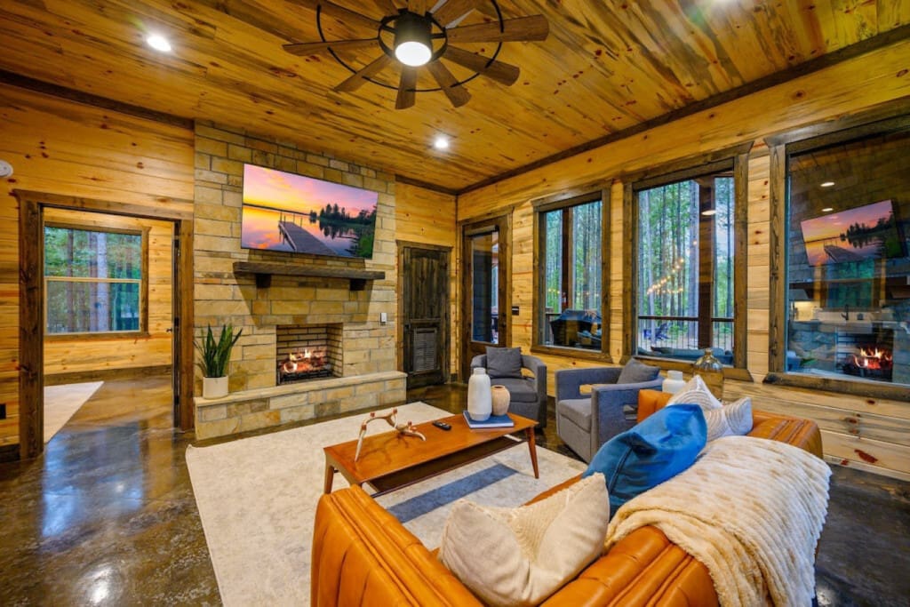 Relax in the cozy embrace of Unplugged's living room, complete with a smart TV for entertainment and an indoor fireplace that adds a touch of warmth.
