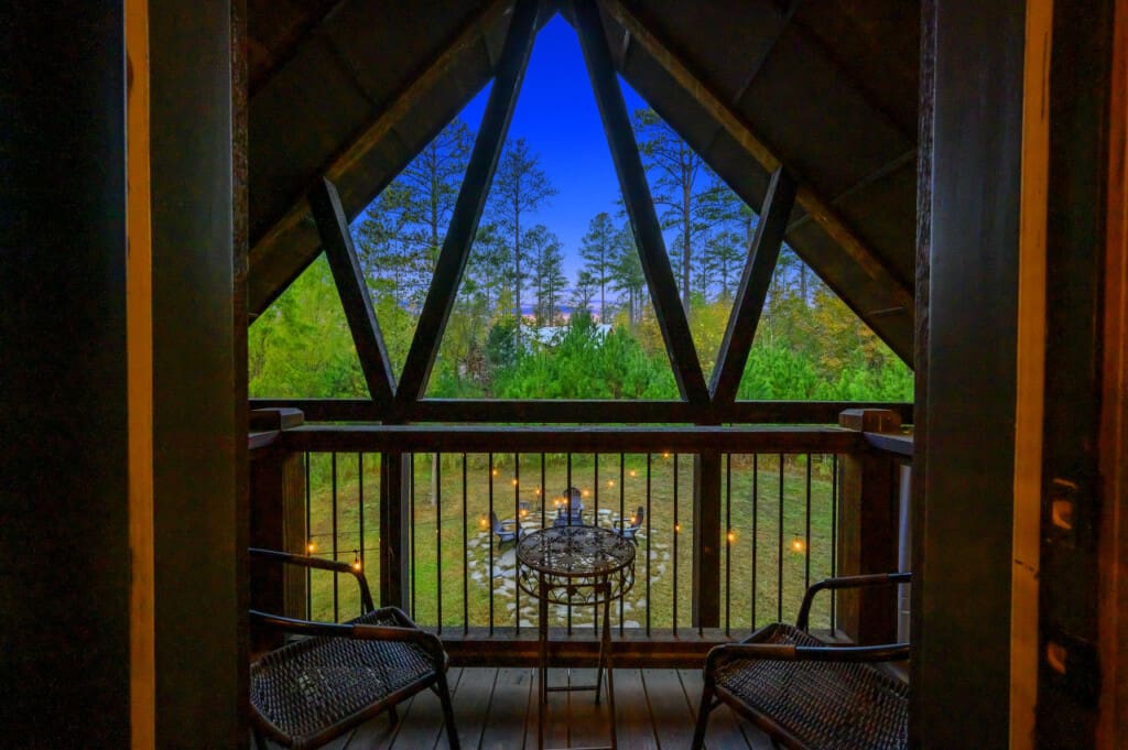 The serene space of Daydream Chalet's balcony, where breathtaking views and relaxation converge.