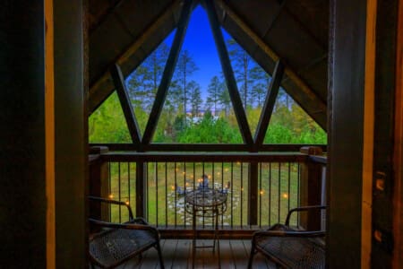 The serene space of Daydream Chalet's balcony, where breathtaking views and relaxation converge.