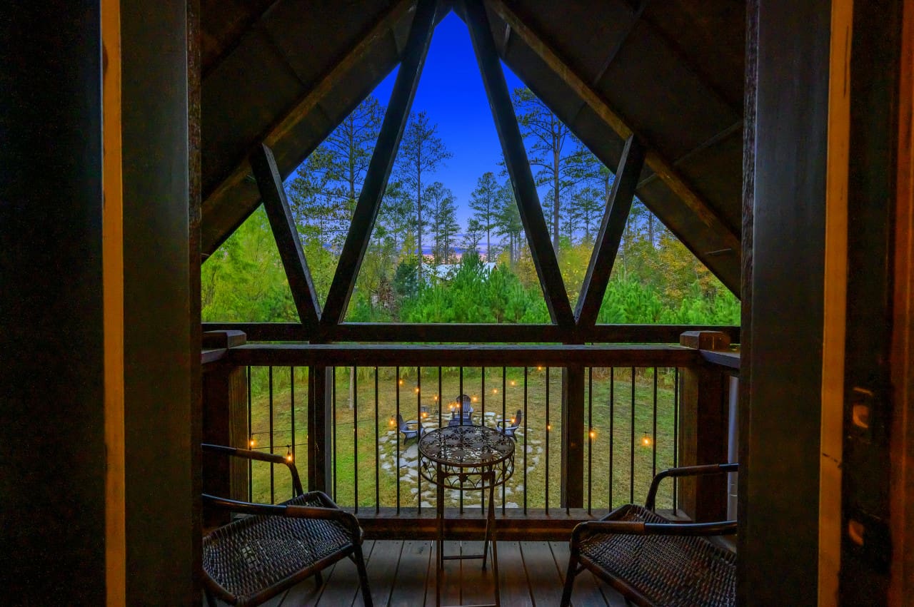 The serene space of Daydream Chalet's balcony, where breathtaking views and relaxation converge.