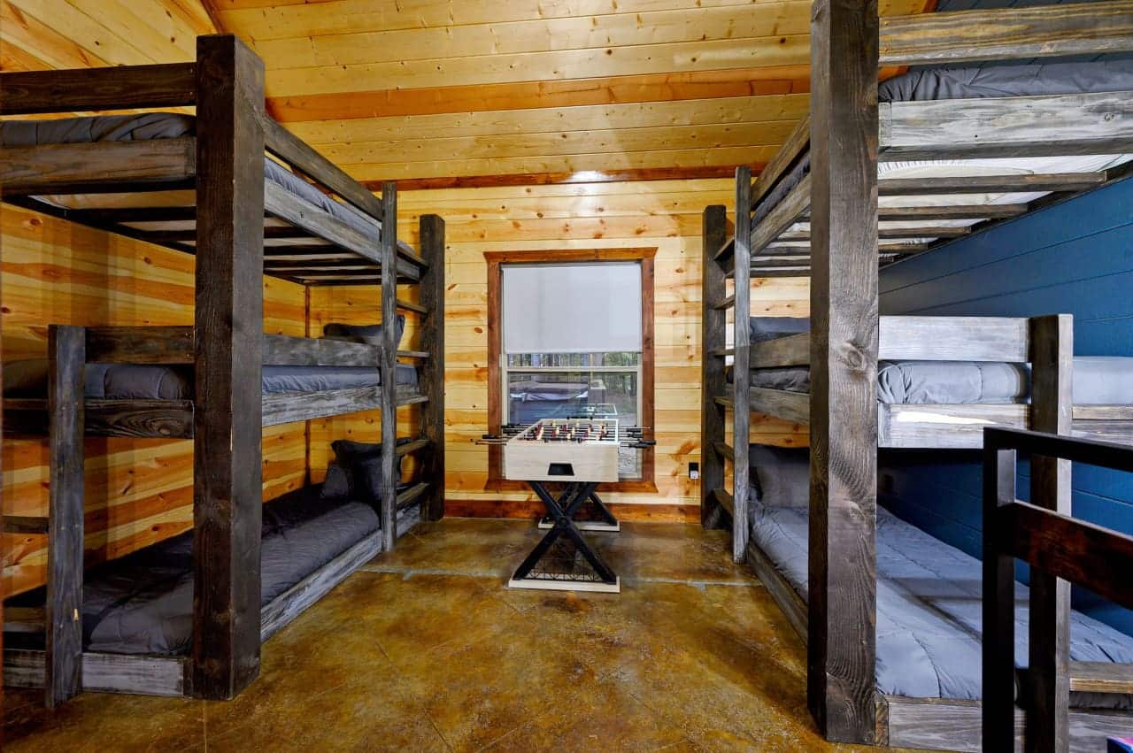 Dream amidst the pines: Our cabin bedroom offers a window to the wild.