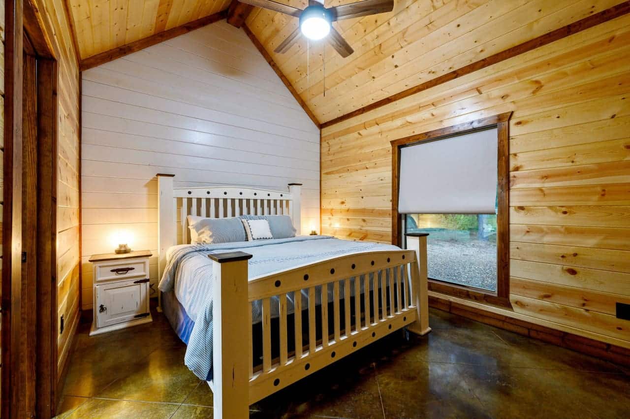 Wake up to wilderness: A cabin bedroom with a view that inspires.