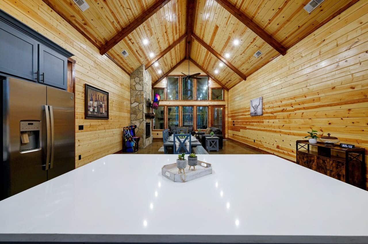 Elevate your escape: Our cabin's white countertops exude rustic luxury.