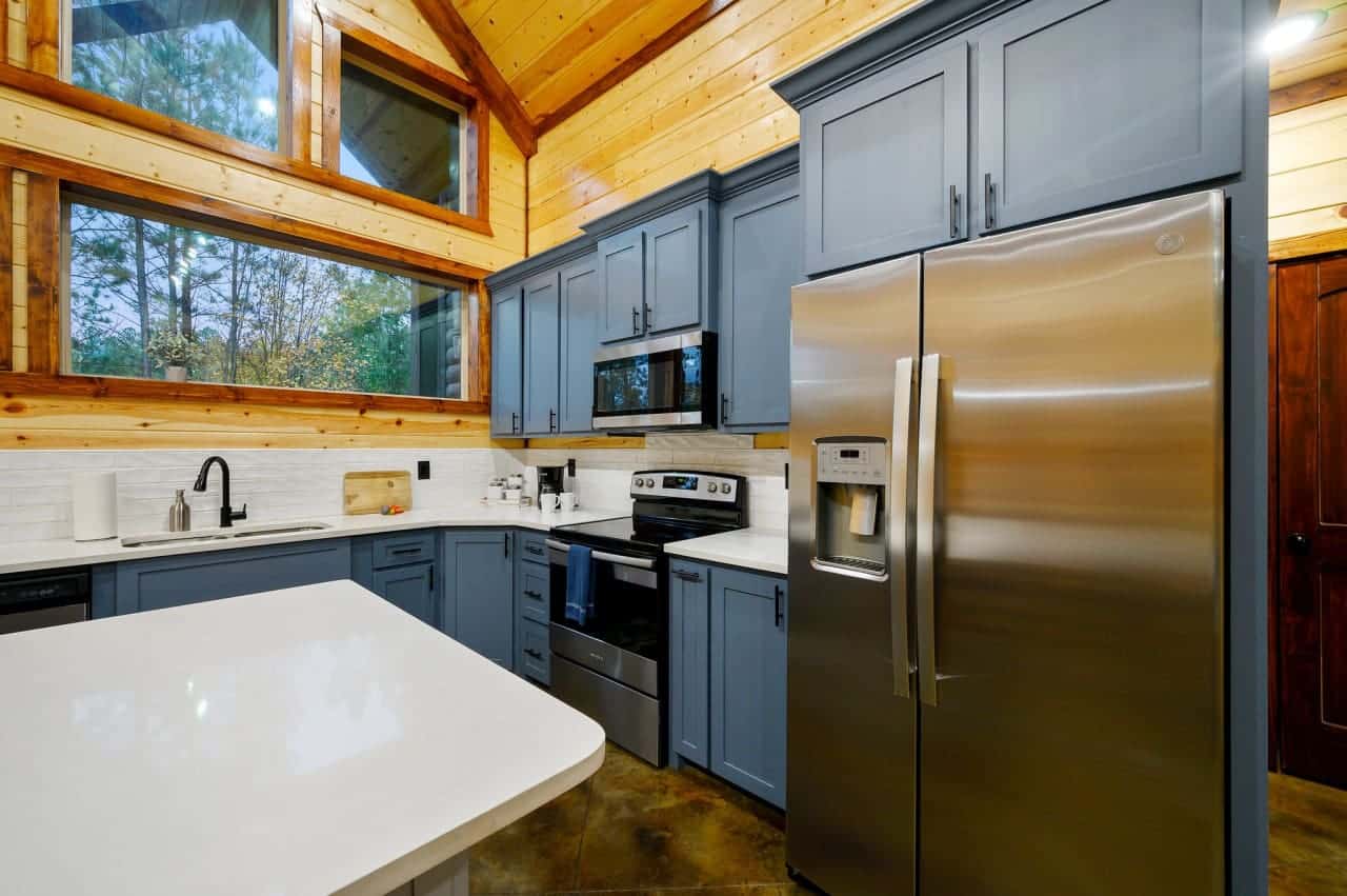 Crisp and inviting: Our white countertop pops against the cool hues of the blue cupboards.