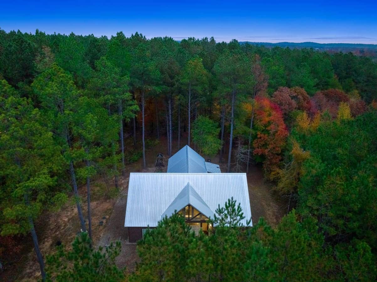 Cabin magic from above: Marvel at the enchanting view of our rustic retreat.