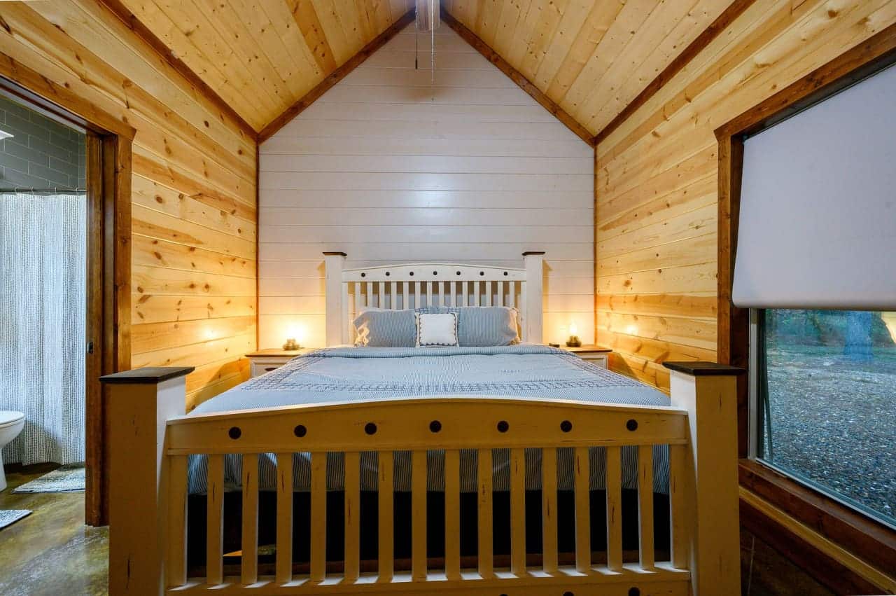 A room with a view, a dream come true: Let our cabin bedroom be your nature-inspired haven.