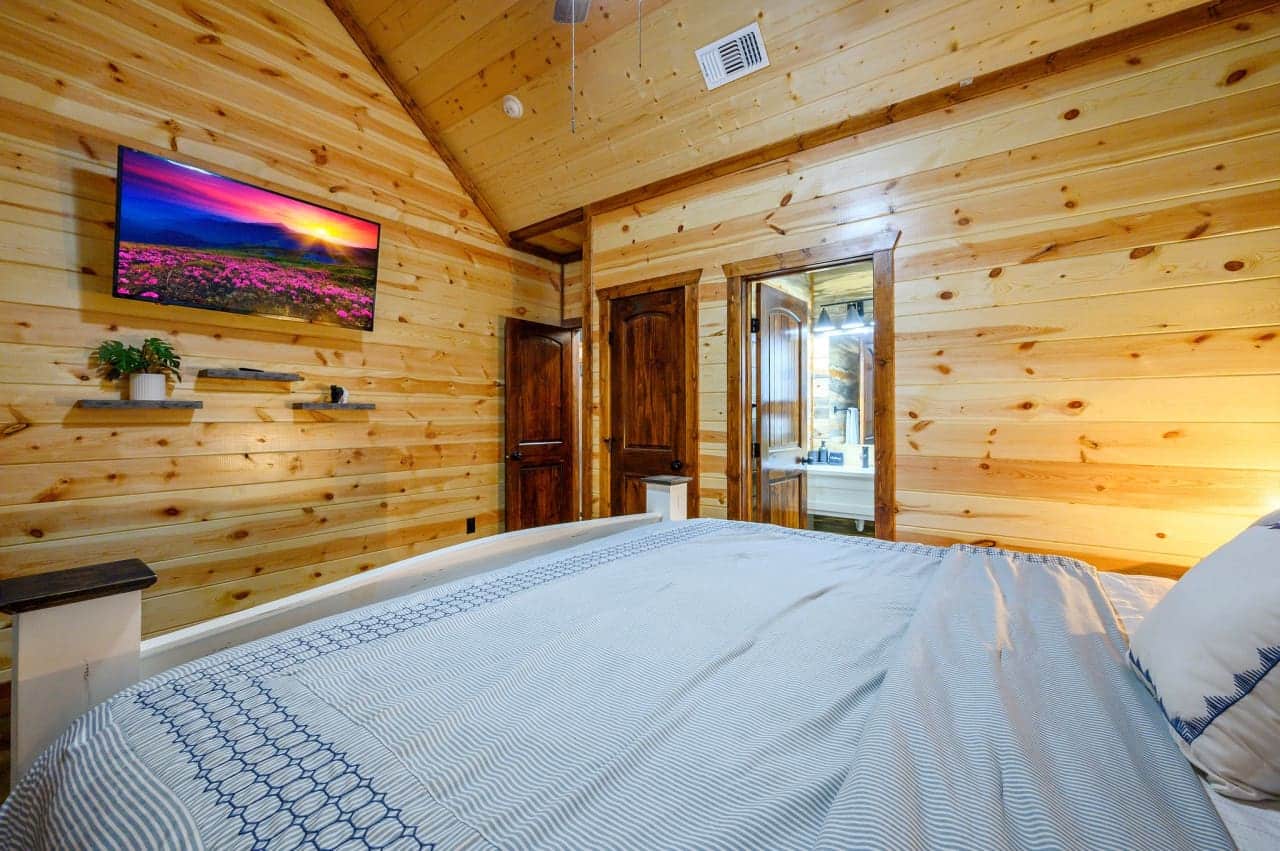Unwind in style: Enjoy the best of both worlds with our bedroom featuring a TV.