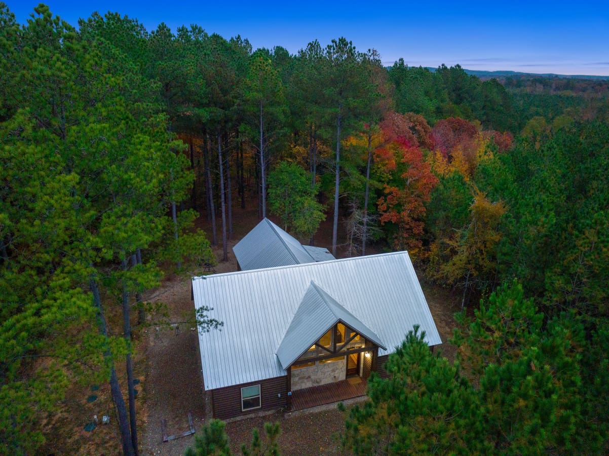 Nature's masterpiece: Admire the scenic wonder of our cabin from a bird's eye view.