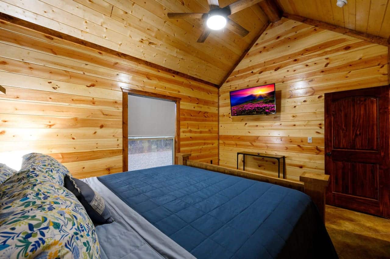 Our cabin bedroom offers a window to the wild.