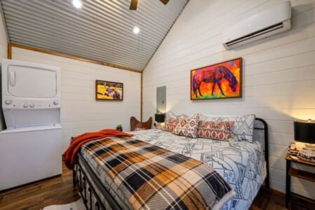 Amidst the plush pillows and cozy layers, this bed is not just a place to rest; it's a sanctuary where tired souls find respite and dreams come to life in the soft glow of night