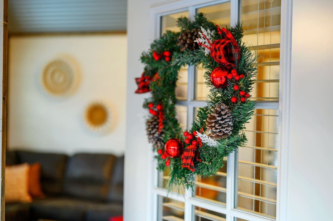 A touch of Christmas coziness at our cabin door.