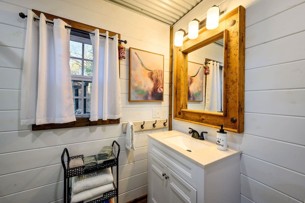 Rustic charm meets modern comforts in our bathroom retreat.