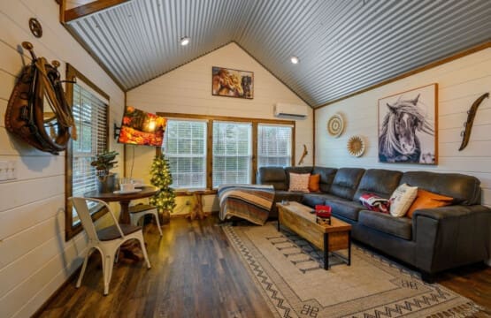 Cabin coziness, Christmas cheer – where the warmth of the fireplace meets the twinkle of the tree.