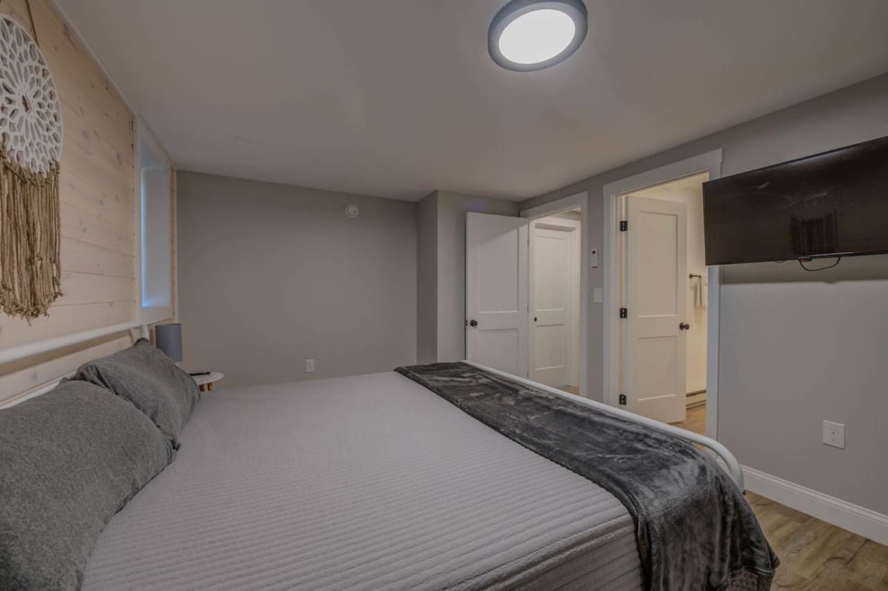 Our bedroom features a sleek flat screen, offering the perfect retreat for cozy nights in and cinematic escapes.
