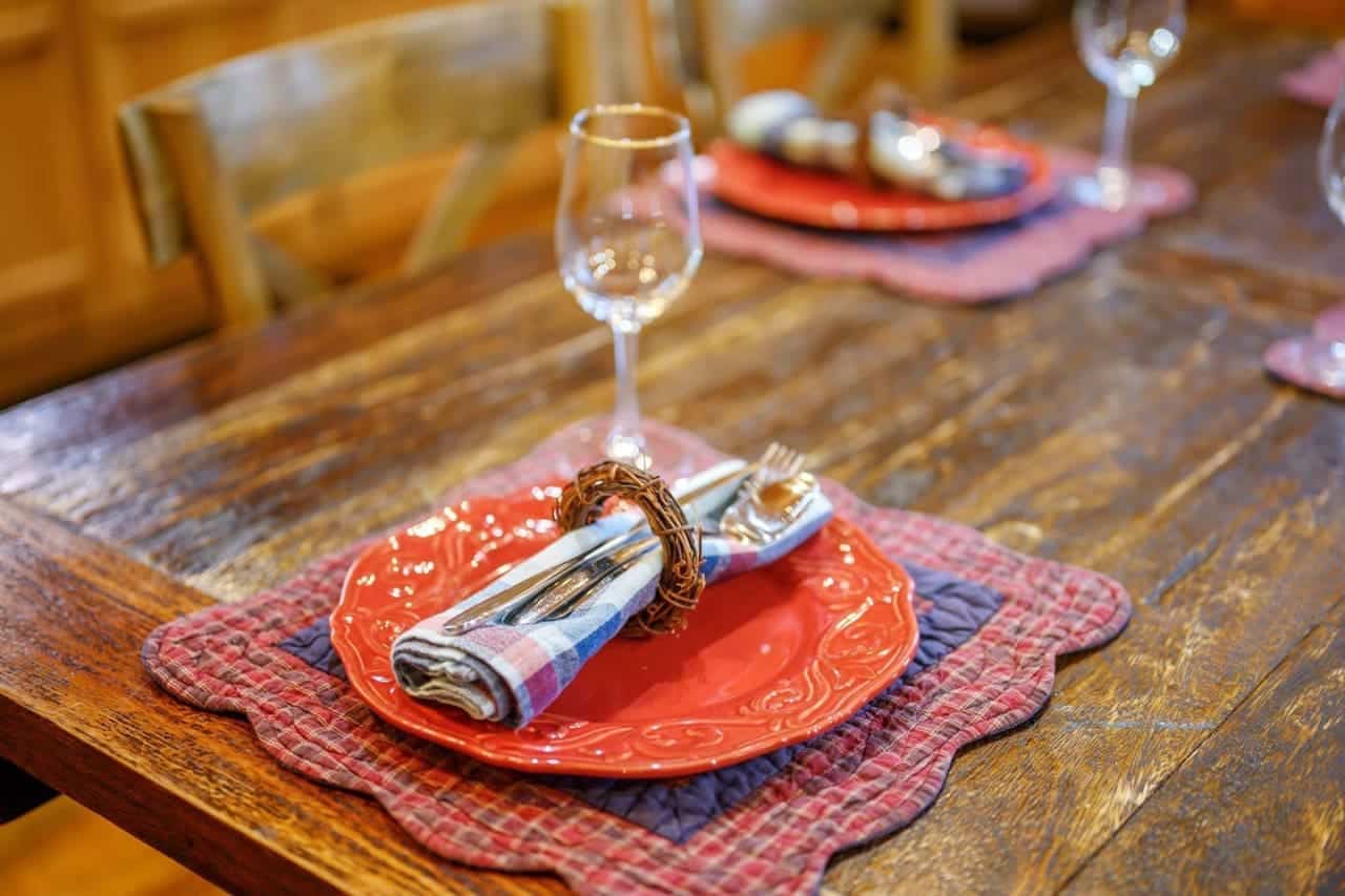 Where meals become memories in the rustic embrace of the cabin's dining table.