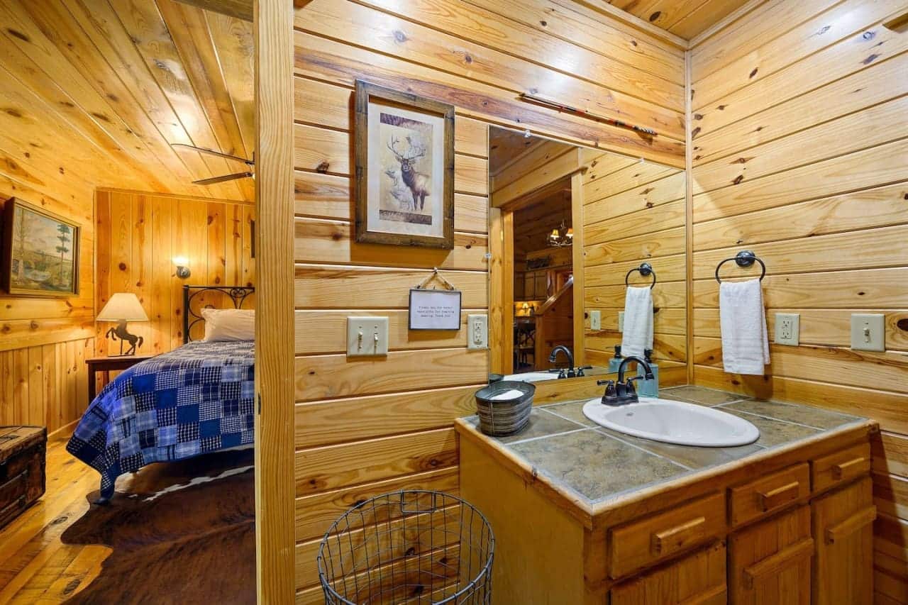 Where cabin dreams lead to tranquil bathroom moments.
