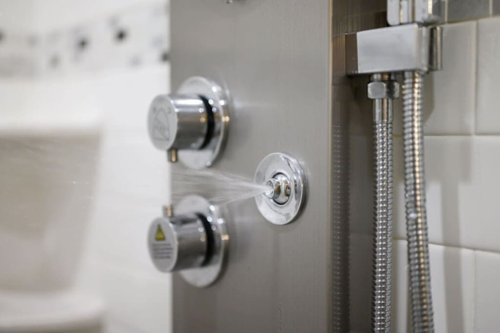 You've got multiple shower heads and a rainfall showerhead situation going on—basically a spa experience tucked into this bathroom.