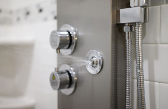 You've got multiple shower heads and a rainfall showerhead situation going on—basically a spa experience tucked into this bathroom.