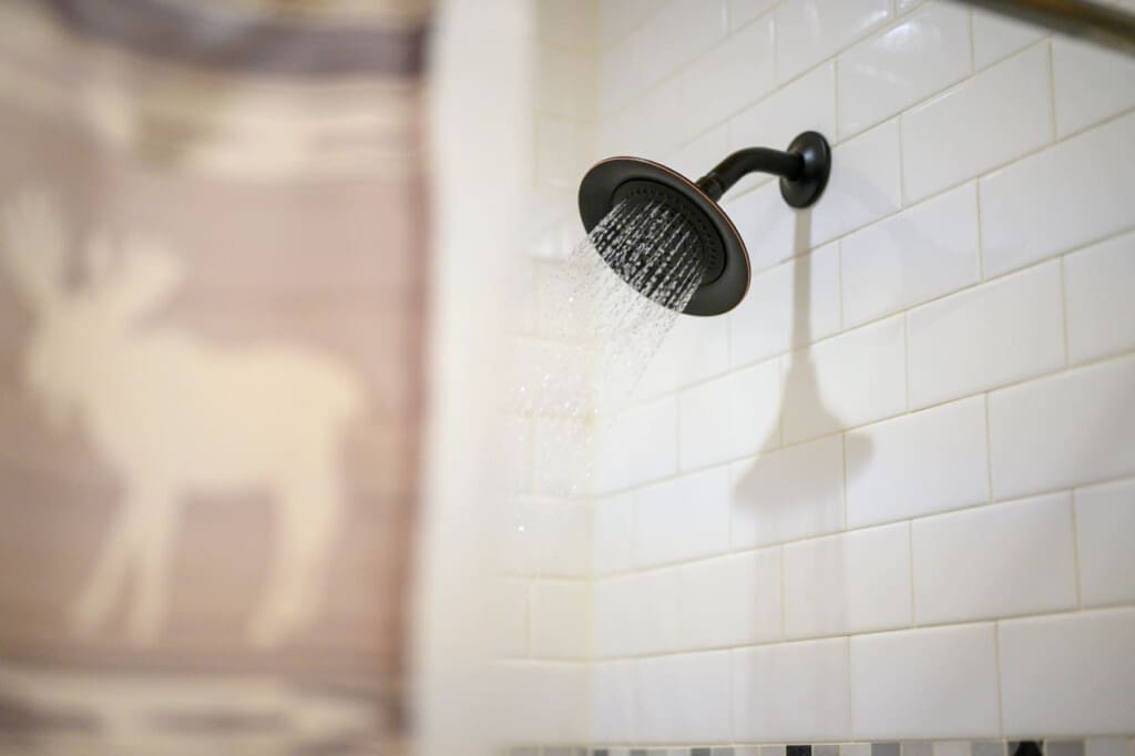Refreshing moments under our cabin's soothing shower